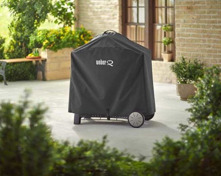 The Weber Family Q 3000 BBQ and Cover on the Patio